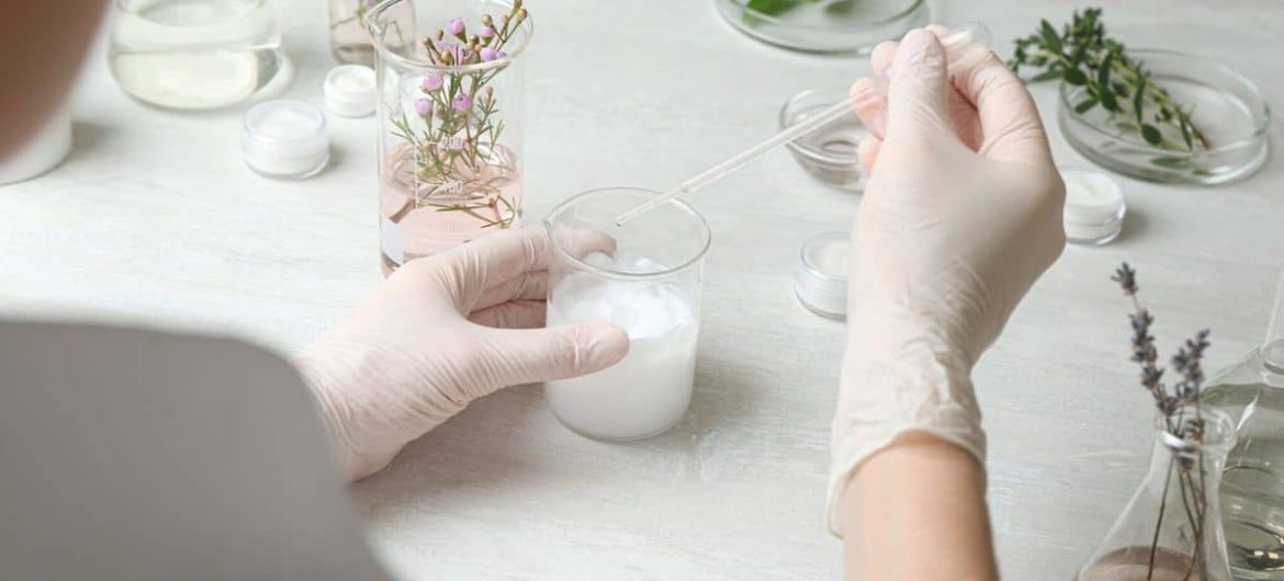 Scientist developing cosmetic product in laboratory, closeup
